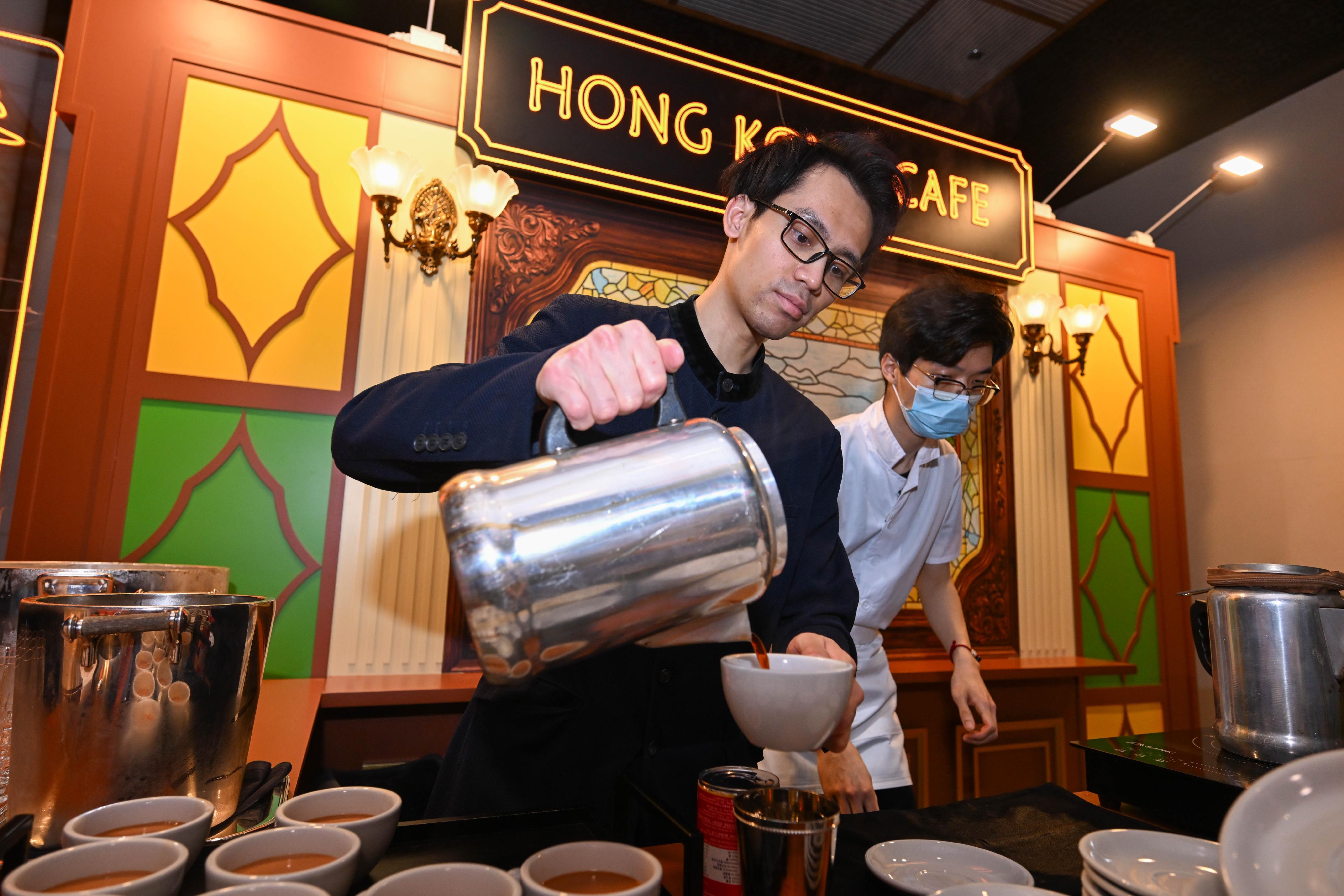 Hong Kong signature food booths are set up at the venue of the Wealth for Good in Hong Kong Summit, allowing attendees from around the world to taste local delicacies during the networking sessions today (March 24).